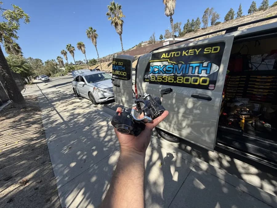 Hyundai ignition work at the curb beside the Auto Key SD van