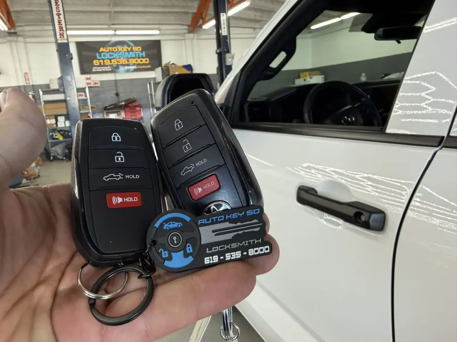 Two Toyota Tundra smart keys at the Auto Key SD workshop on Rosecrans Street