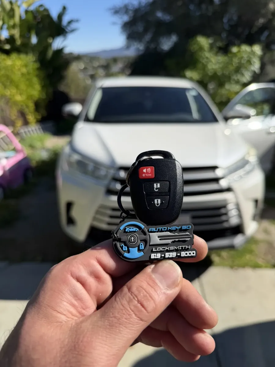 Toyota Highlander remote key held in front of the vehicle